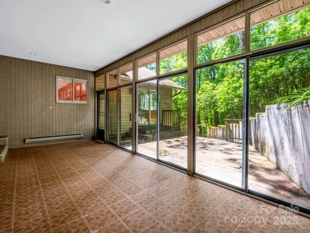 a view of wooden fence and trees
