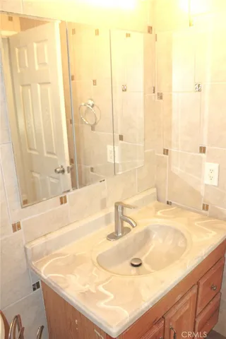 a bathroom with a tub sink and a shower