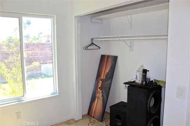a view of a livingroom with furniture and a window