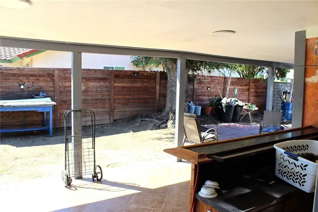 a room view with a floor to ceiling window and a table