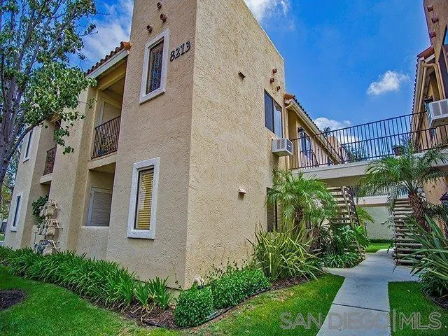 8213 Jade Coast Road, Unit 77 San Diego, CA 92126 - Photo 2 of 6 a view of a pathway along the house