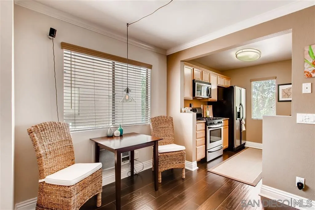 8213 Jade Coast Road, Unit 77 San Diego, CA 92126 - Photo 3 of 6 a living room with furniture and a flat screen tv