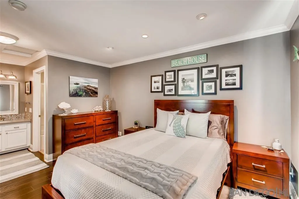 8213 Jade Coast Road, Unit 77 San Diego, CA 92126 - Photo 5 of 6 a bedroom with a bed and a dresser