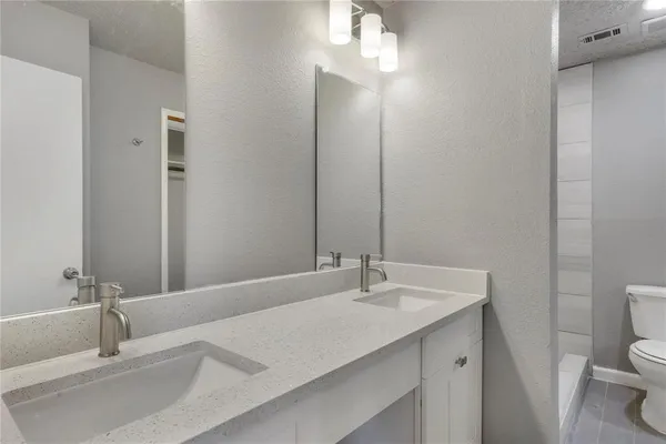 a bathroom with a sink and a toilet