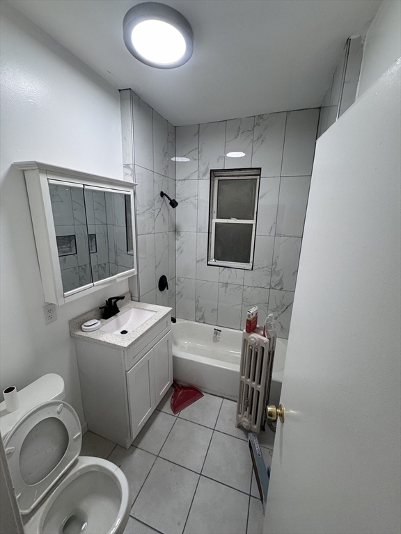 a bathroom with a sink toilet tub and mirror