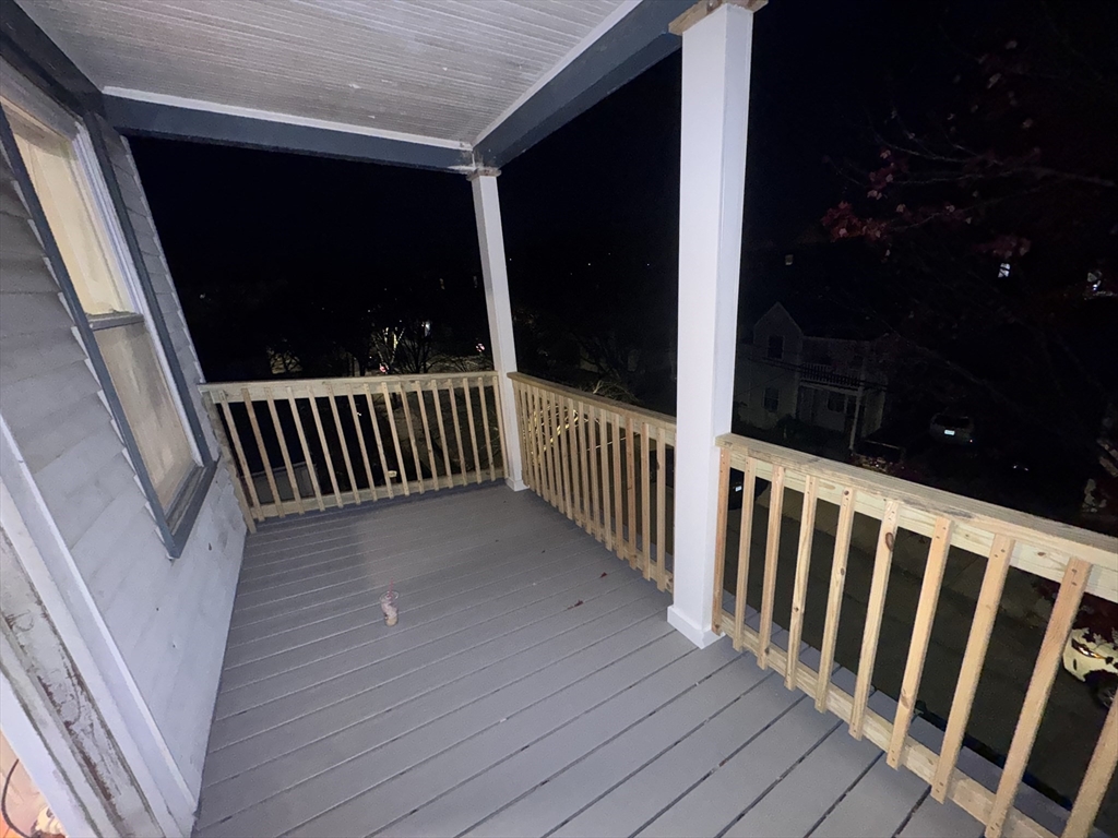 42 Lucerne Street, Unit 3 Boston, MA 02124 - Photo 8 of 8 a view of a balcony with wooden floor