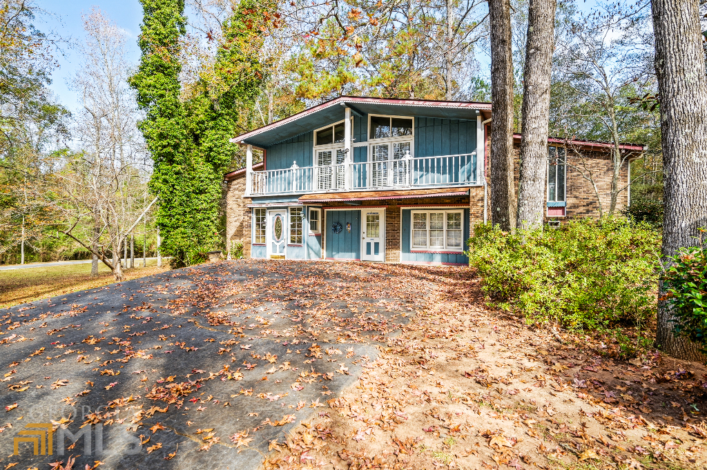 220 Sleepy Creek Road Macon, GA 31210 - Photo 1 of 1 a front view of a house with a garden