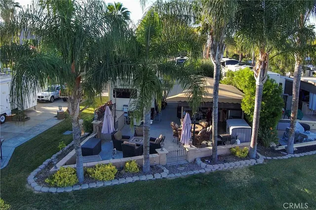 a view of a patio with furniture and a yard