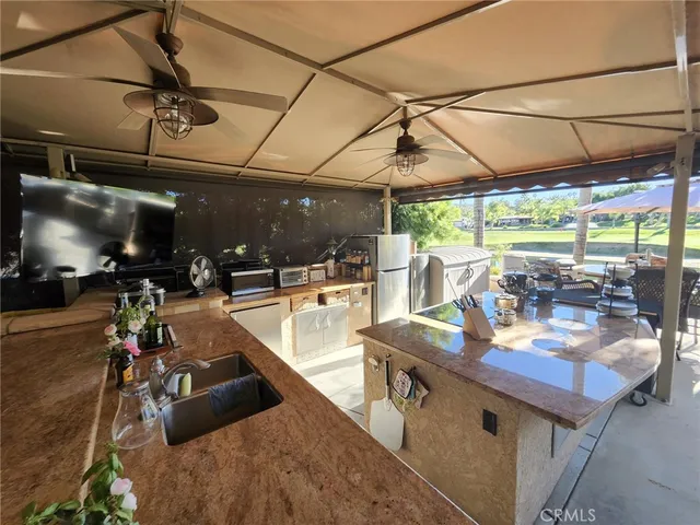 a view of outdoor space with seating area and roof