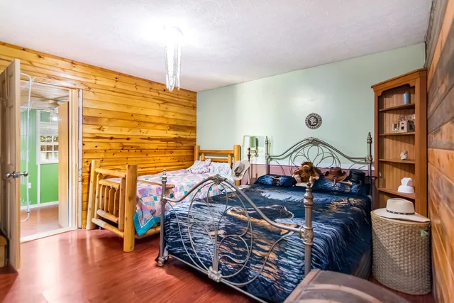 a bedroom with furniture and a window