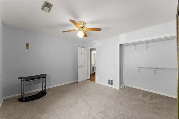 a view of a storage & utility room with a window
