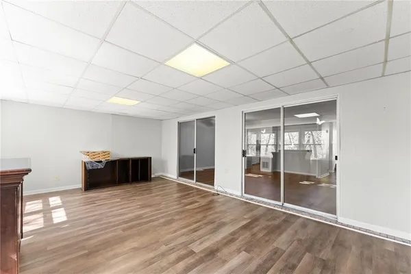a room with wooden floor and natural light