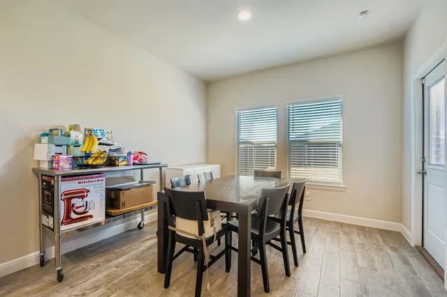 a view of a dining room with furniture and window