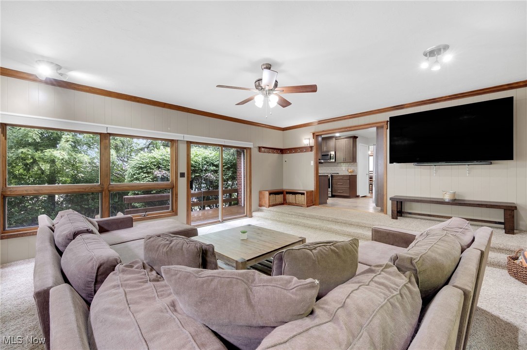 10620 Ridge Road North Royalton, OH 44133 - Photo 10 of 35 Living room featuring light colored carpet, a ceiling fan, and crown molding