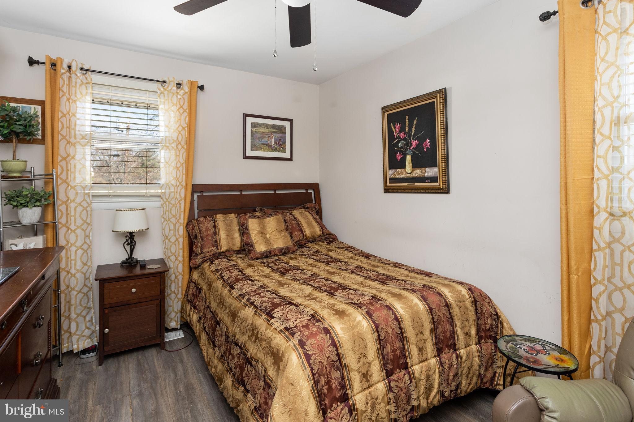 19 Spruce Road Burlington, NJ 08016 - Photo 16 of 27 a bedroom with a bed and wooden floor