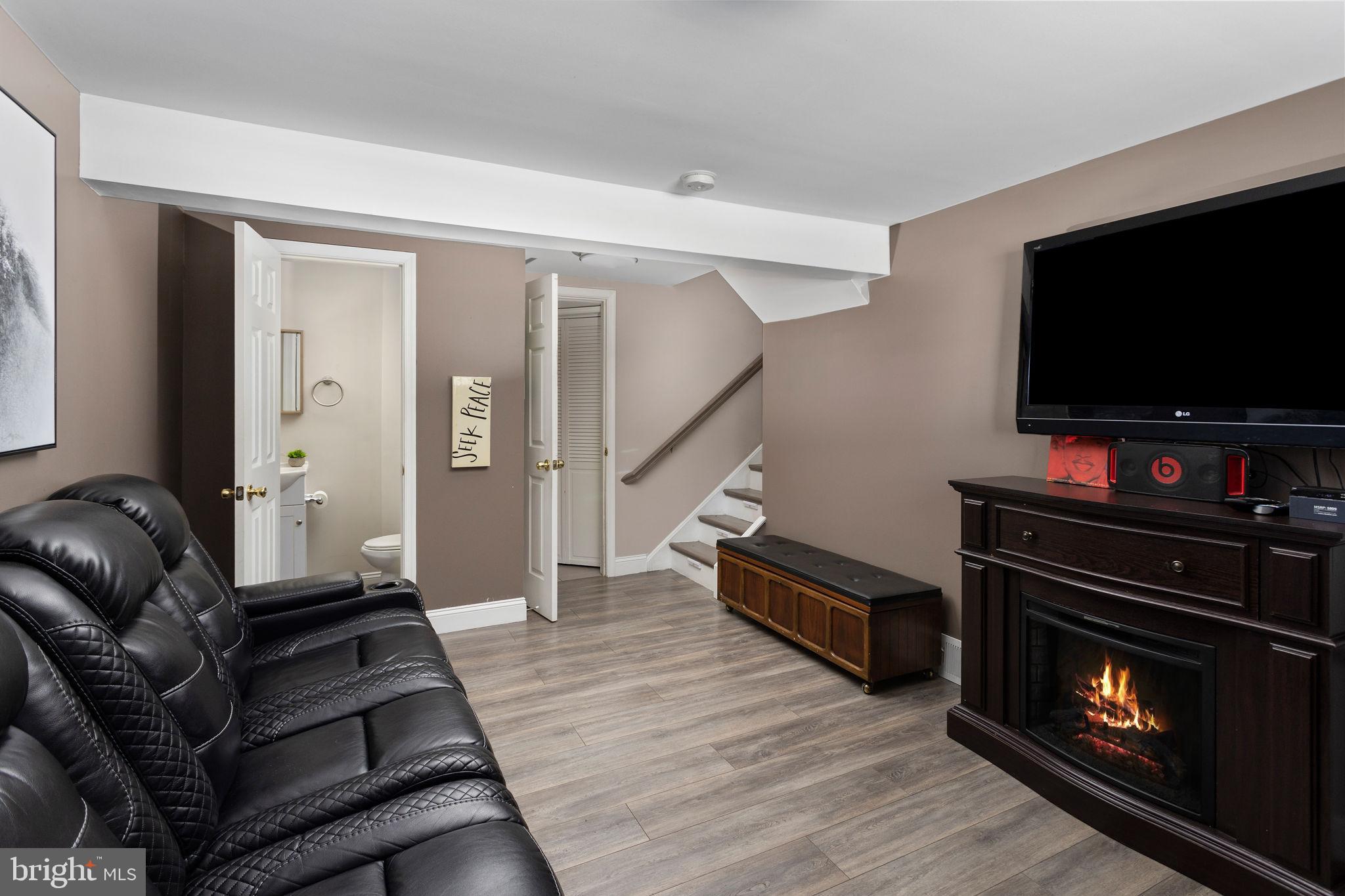 19 Spruce Road Burlington, NJ 08016 - Photo 19 of 27 a living room with furniture and a flat screen tv