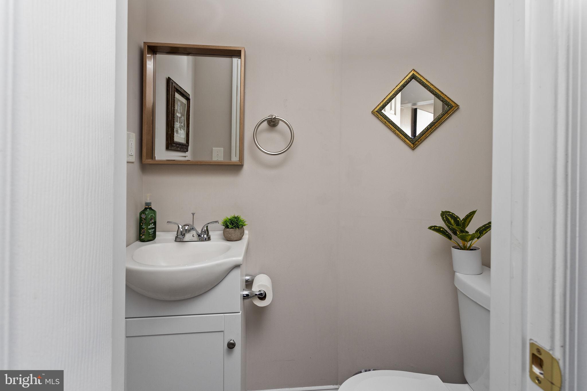 19 Spruce Road Burlington, NJ 08016 - Photo 21 of 27 a bathroom with a toilet a sink and mirror