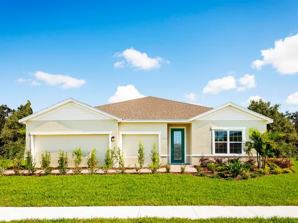 a front view of a house with a yard and porch