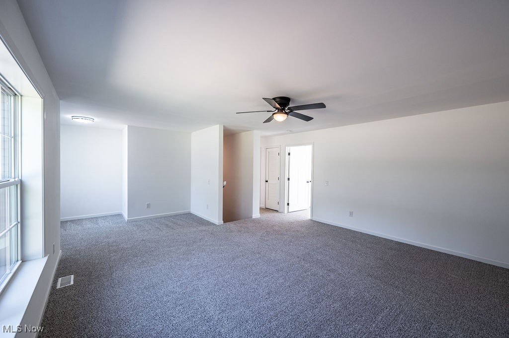 7343 Lost Pavement Road Belleville, WV 26133 - Photo 20 of 49 Spare room with carpet and ceiling fan
