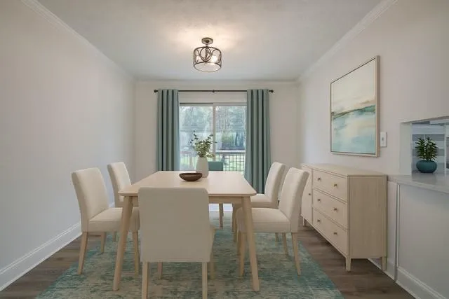a view of a dining room with furniture and a window