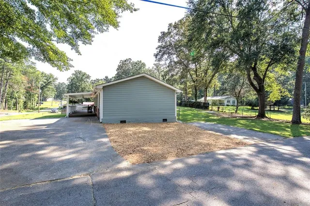 a view of a house with a yard and garage