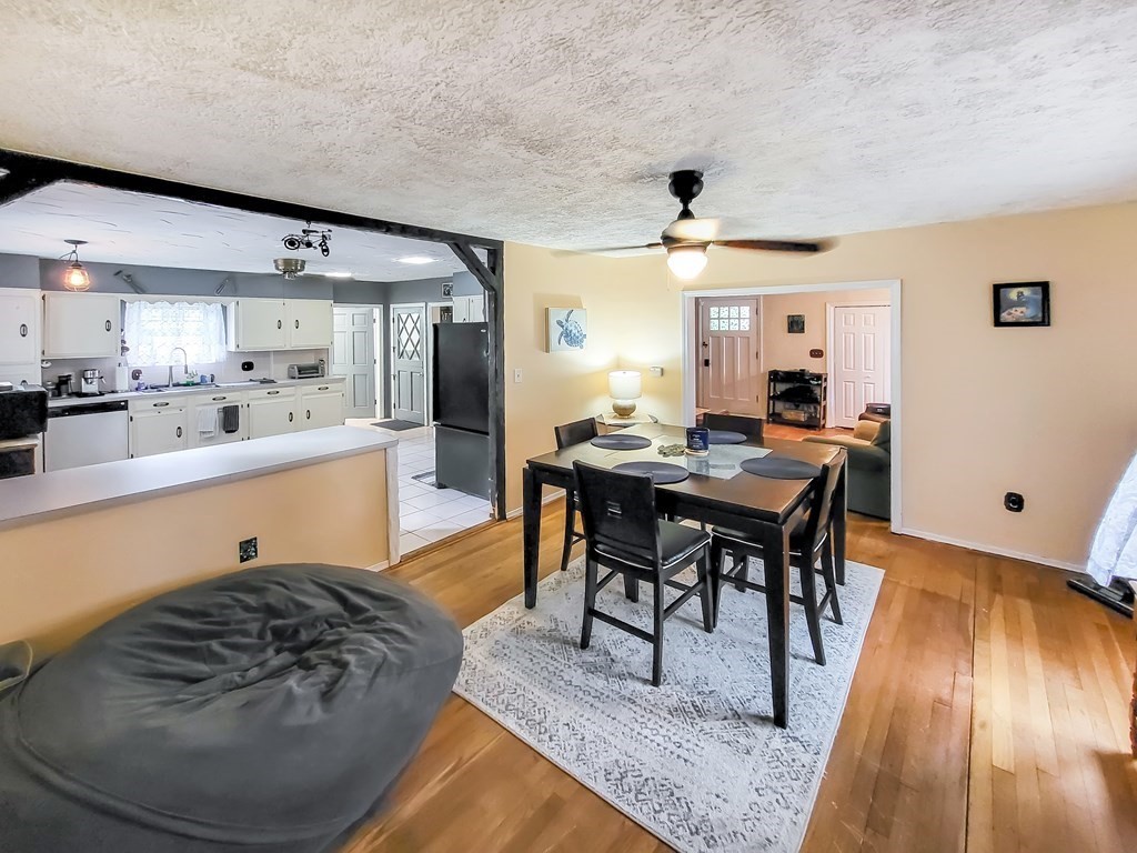 77 Olean Street Worcester, MA 01602 - Photo 14 of 42 a living room with stainless steel appliances kitchen island granite countertop furniture and a large window