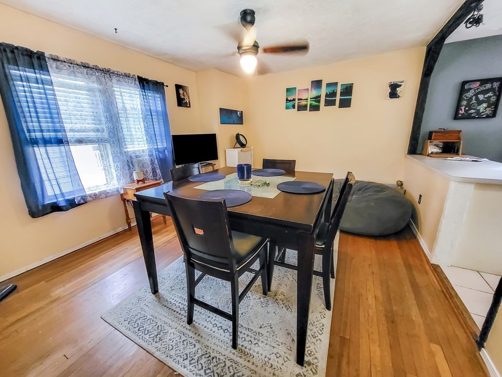 77 Olean Street Worcester, MA 01602 - Photo 15 of 42 a view of a dining room with furniture and wooden floor