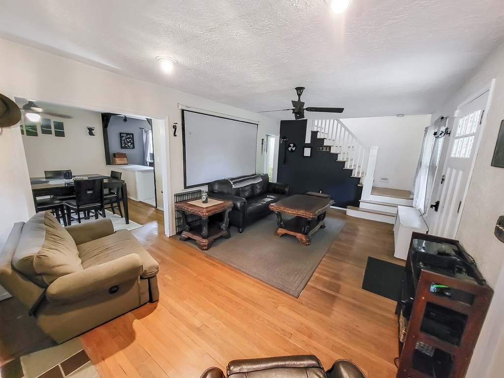 77 Olean Street Worcester, MA 01602 - Photo 17 of 42 a living room with furniture and a flat screen tv