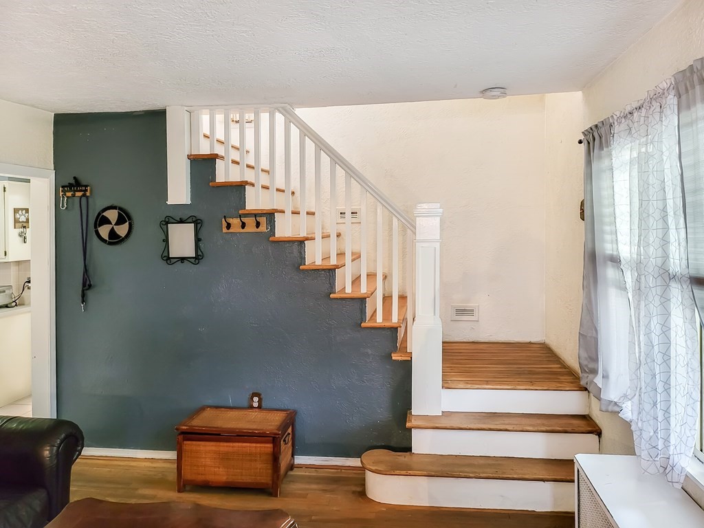 77 Olean Street Worcester, MA 01602 - Photo 19 of 42 a view of entryway and hall with wooden floor