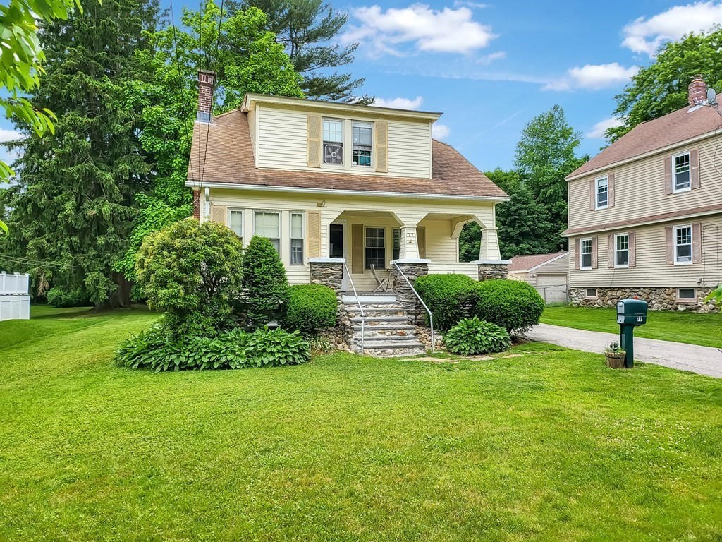 77 Olean Street Worcester, MA 01602 - Photo 2 of 42 a front view of a house with a yard