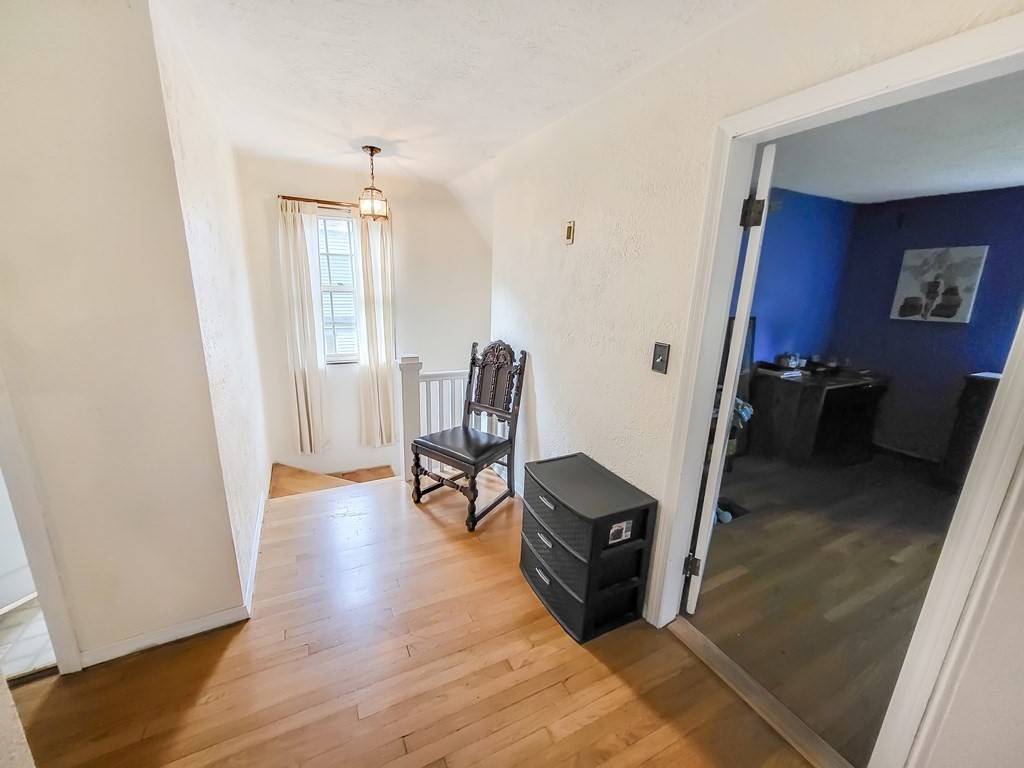 77 Olean Street Worcester, MA 01602 - Photo 22 of 42 a view of a room with furniture and wooden floor