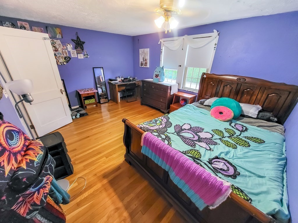 77 Olean Street Worcester, MA 01602 - Photo 23 of 42 a bed room with a bed and a chair