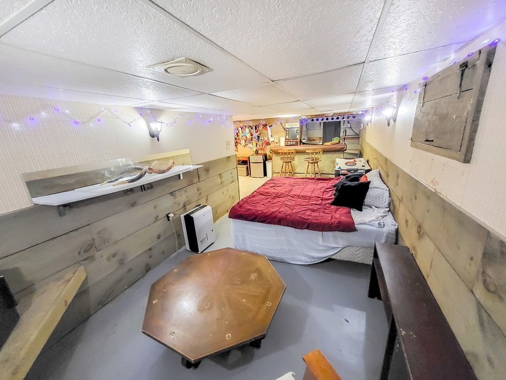 77 Olean Street Worcester, MA 01602 - Photo 38 of 42 a bedroom with furniture and a wooden floor