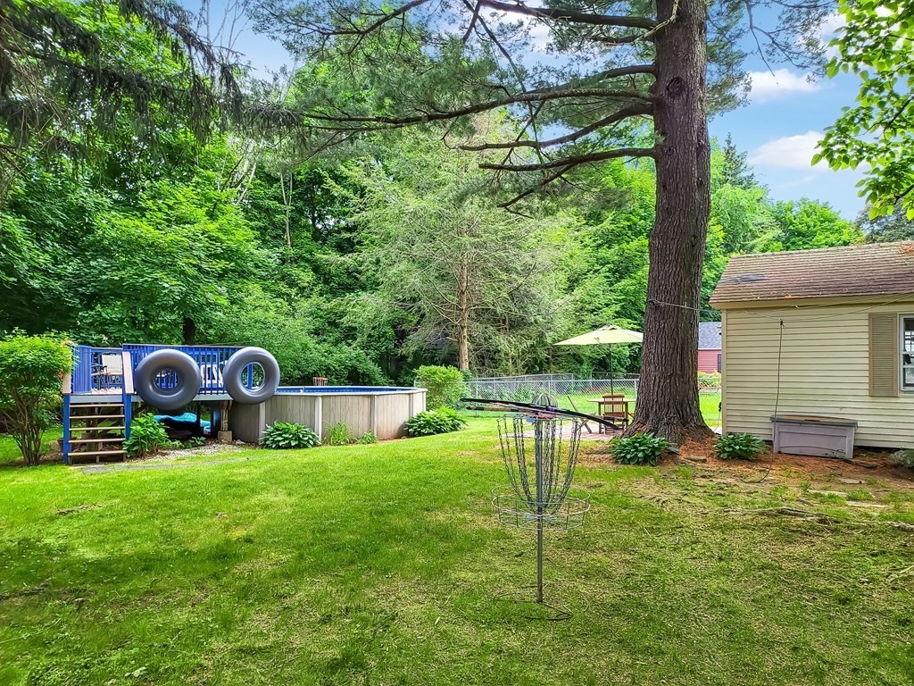 77 Olean Street Worcester, MA 01602 - Photo 7 of 42 a view of backyard with a barn and large trees