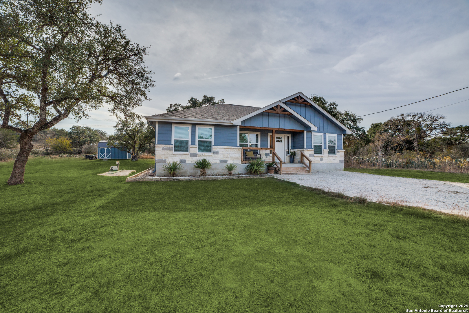 388 Bluff View Drive Spring Branch, TX 78070 - Photo 1 of 25 a front view of a house with a garden and trees