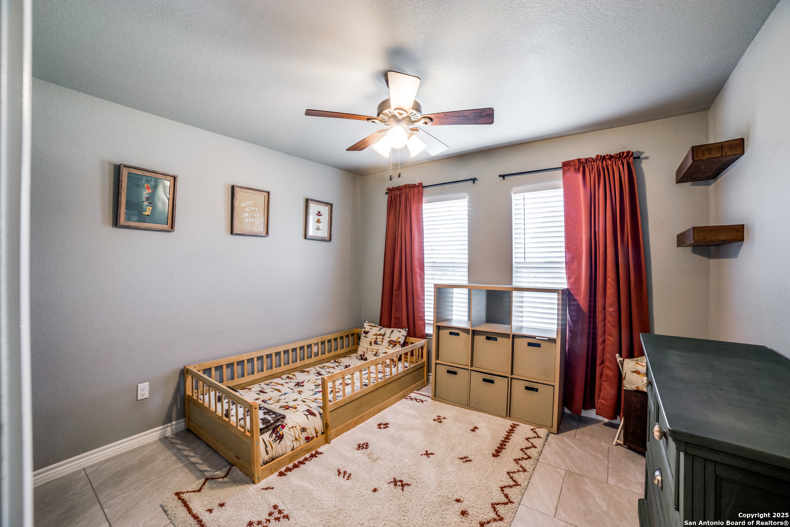 388 Bluff View Drive Spring Branch, TX 78070 - Photo 20 of 25 a bedroom with a bed and a chandelier