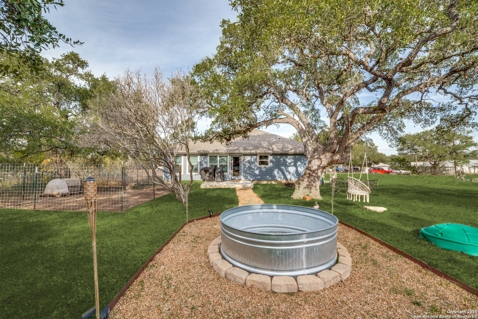 388 Bluff View Drive Spring Branch, TX 78070 - Photo 22 of 25 a view of a house with a backyard and fountain