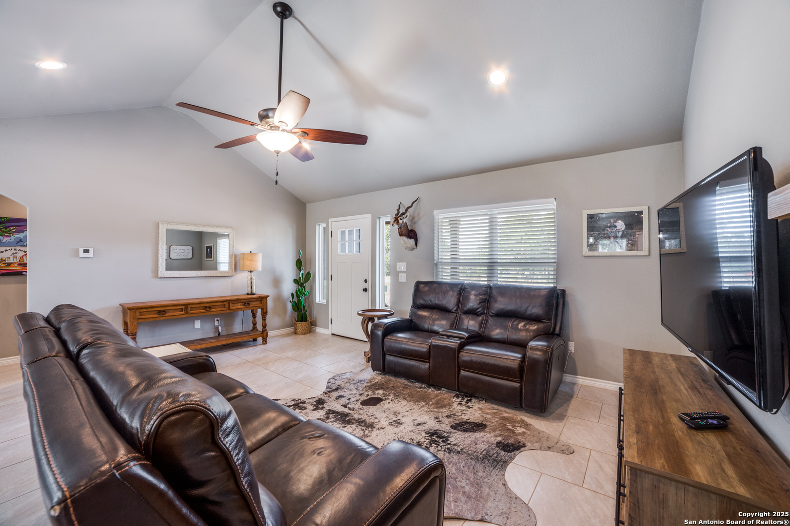 388 Bluff View Drive Spring Branch, TX 78070 - Photo 6 of 25 a living room with furniture ceiling fan and a window
