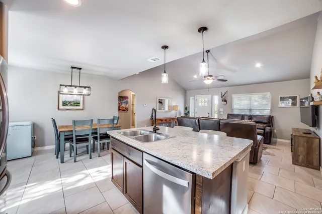 a kitchen with a dining table and chairs