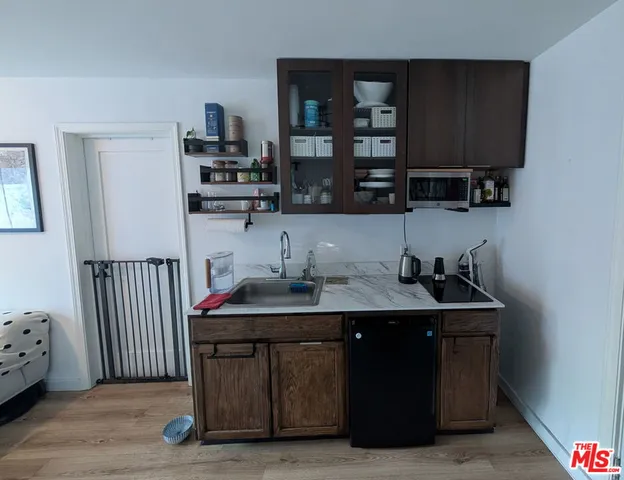 a room with a sink and a cabinets