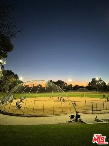 a view of a swimming pool with an outdoor seating and yard