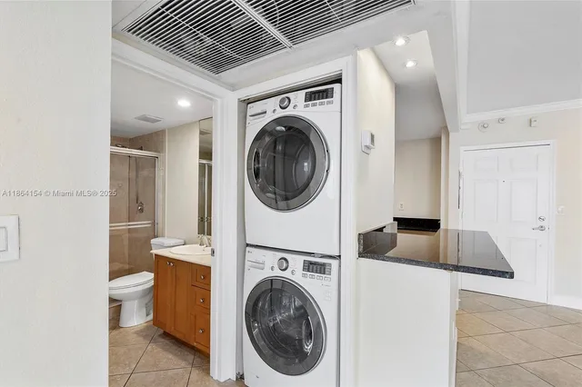 a view of a kitchen with washing machine and a sink