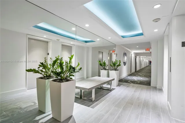 a lobby with furniture and a table