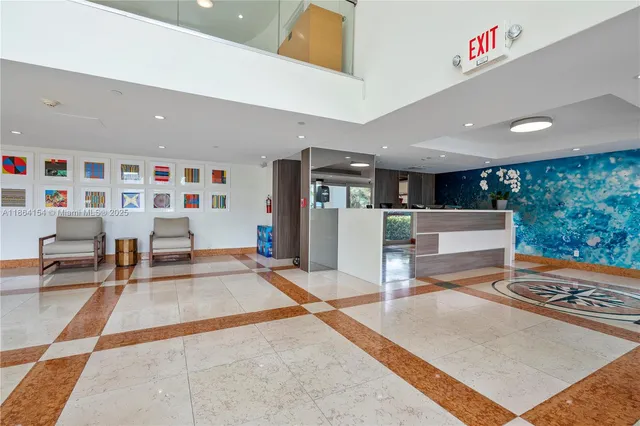 a view of a city with tall buildings and ocean view