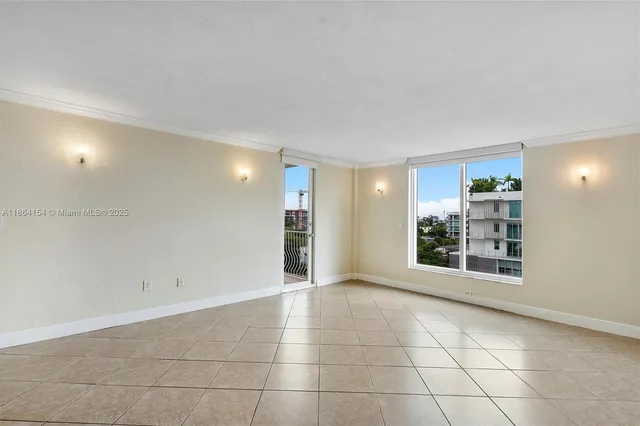 a view of an empty room with a window