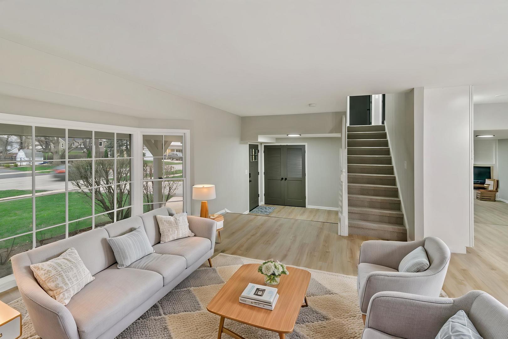 1554 Chickasaw Drive Naperville, IL 60563 - Photo 12 of 32 a living room with furniture and a window