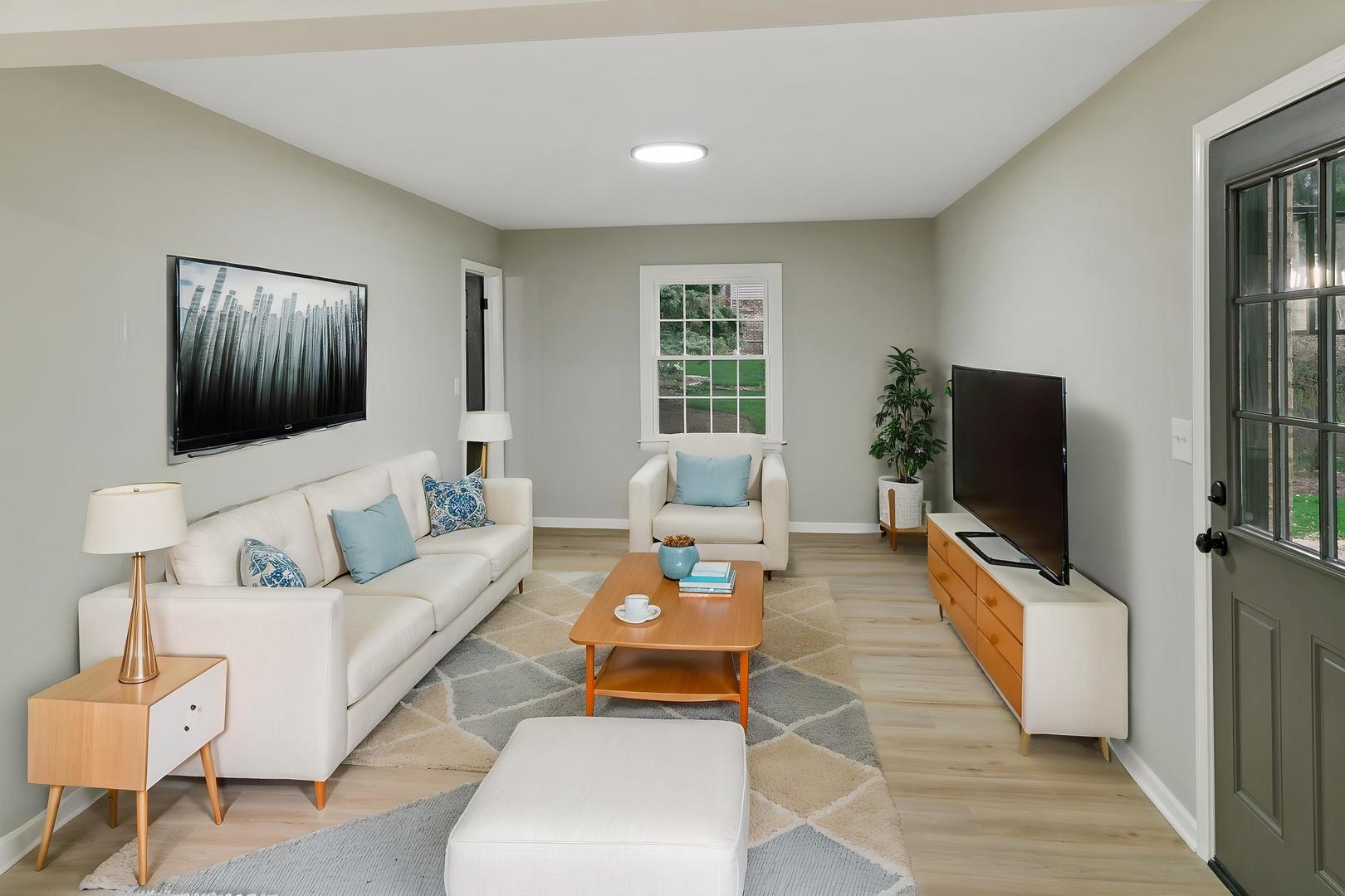 1554 Chickasaw Drive Naperville, IL 60563 - Photo 15 of 32 a living room with furniture and a flat screen tv