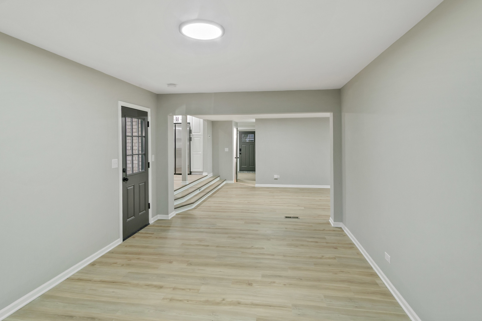 1554 Chickasaw Drive Naperville, IL 60563 - Photo 16 of 32 a view of a hallway with wooden floor