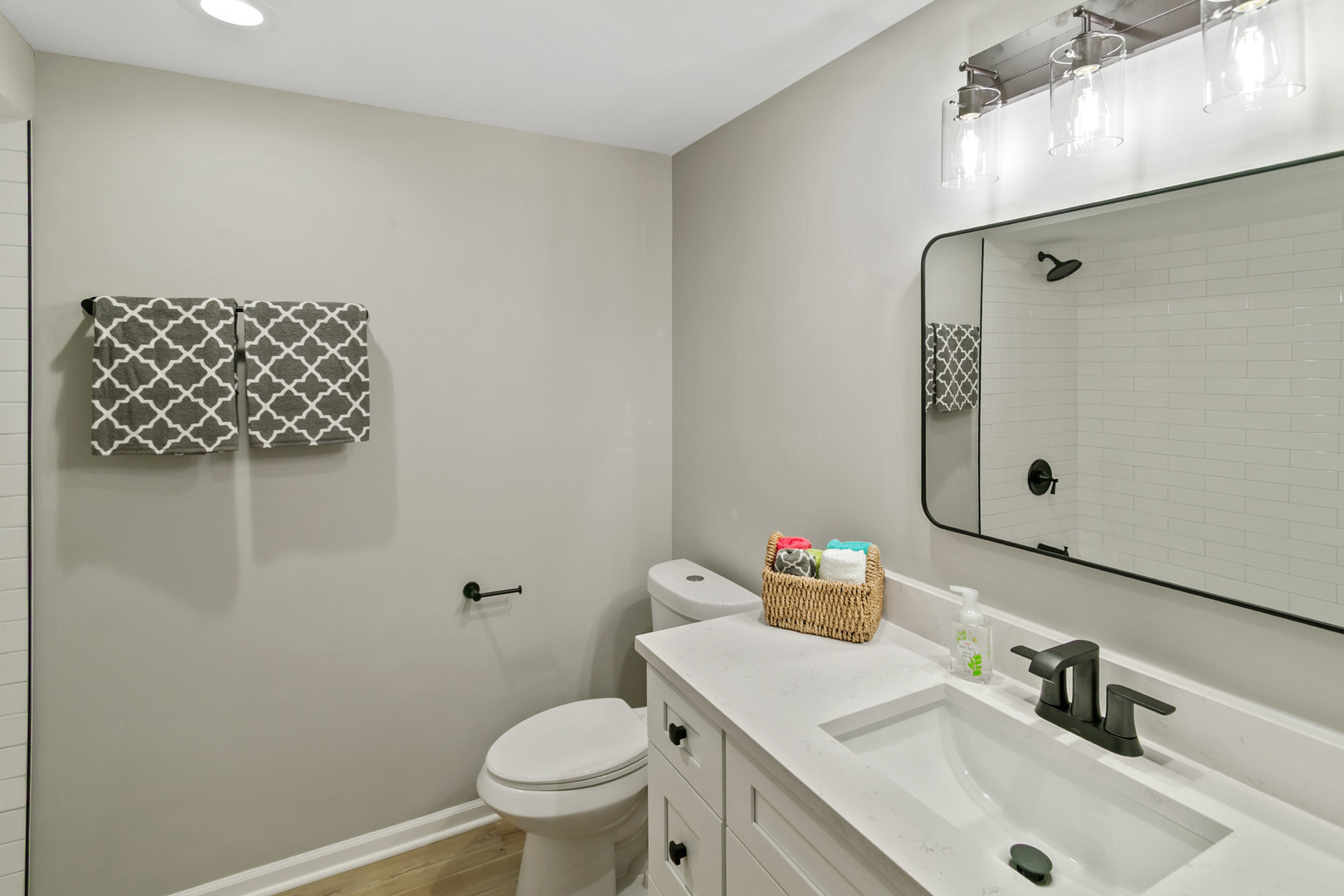 1554 Chickasaw Drive Naperville, IL 60563 - Photo 27 of 32 a bathroom with a sink mirror vanity and toilet