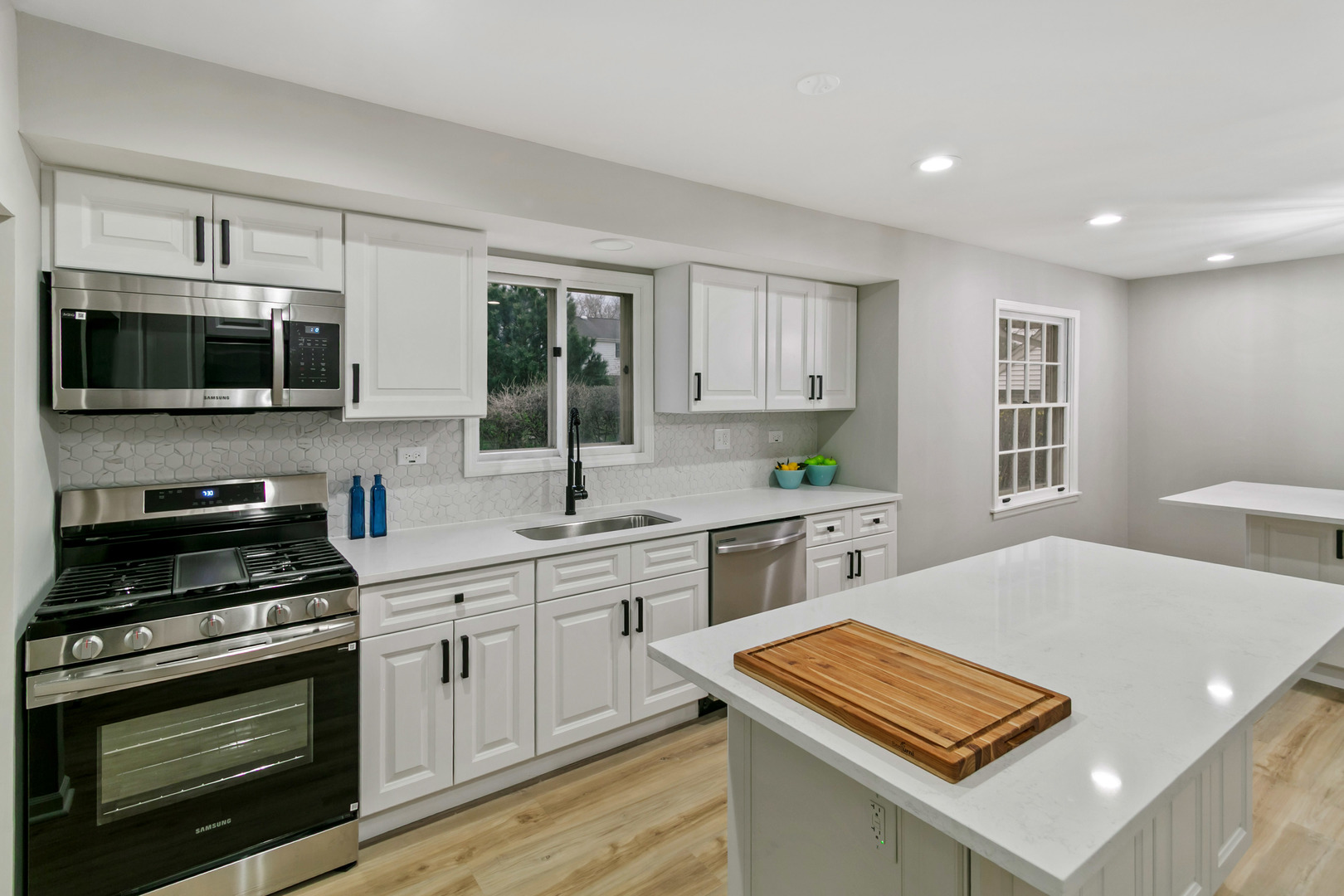 1554 Chickasaw Drive Naperville, IL 60563 - Photo 6 of 32 a kitchen with stainless steel appliances a stove microwave and sink